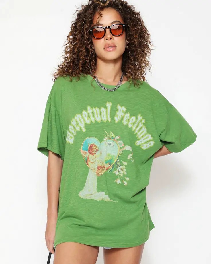 A Green Oversized Tee Featuring a Vintage Graphic