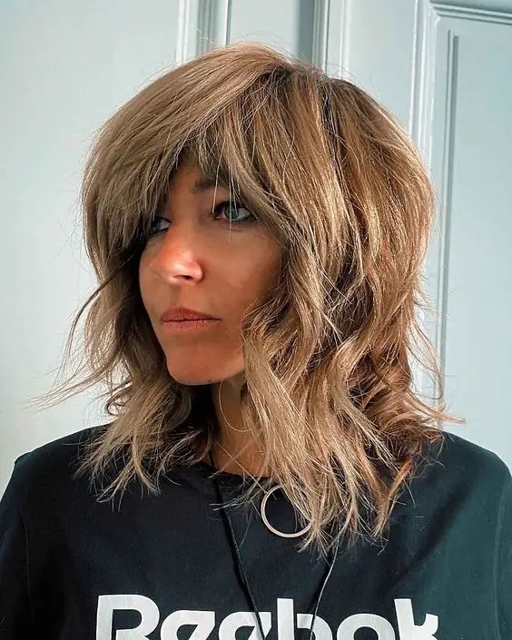 Long Wolf Cut with Side-Swept Bangs