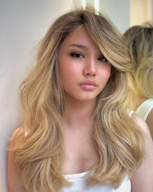 Long Hair with Side-Parted Bangs: Elegant Statement