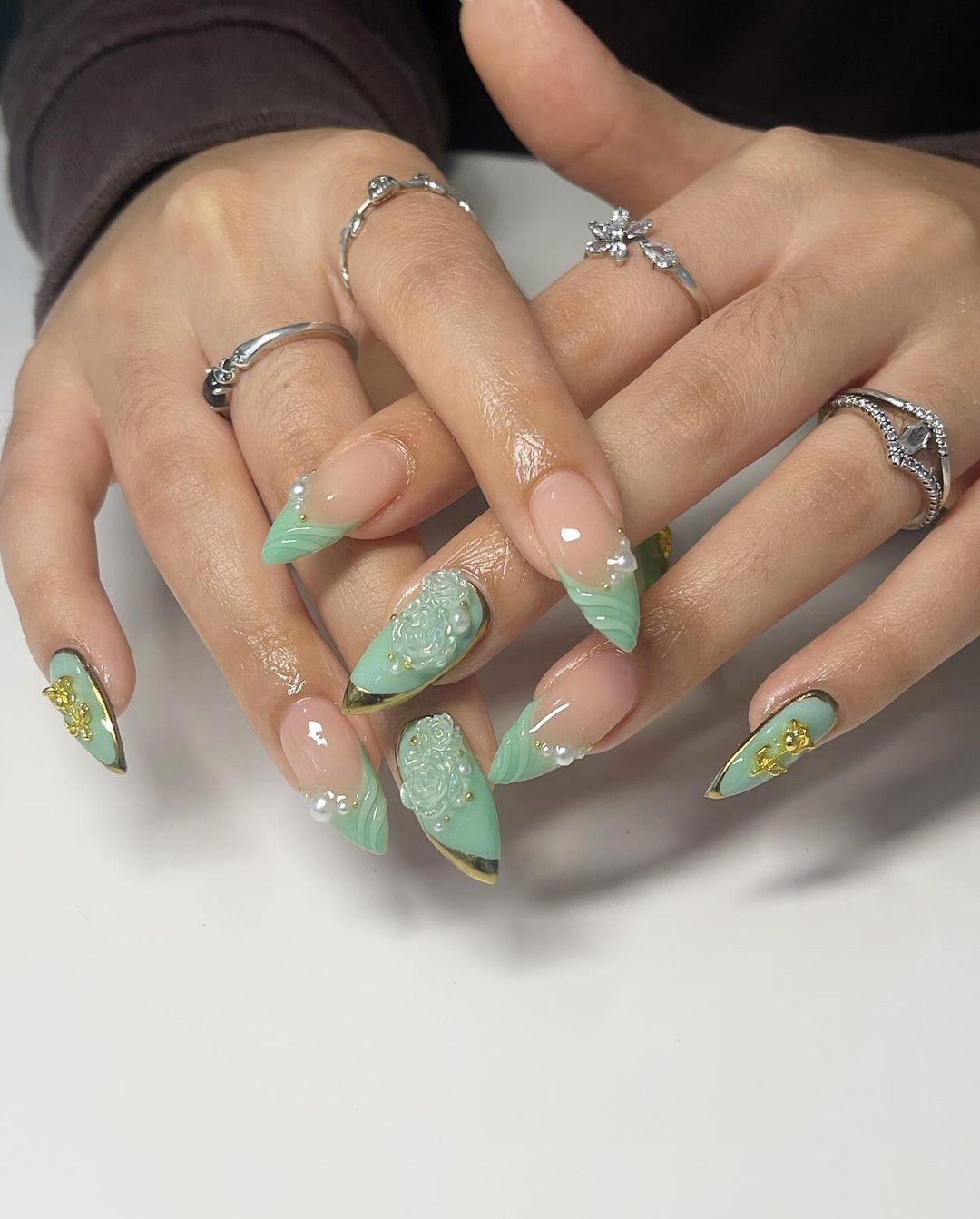 Almond Nails with a Green Gradient and Gold Accents