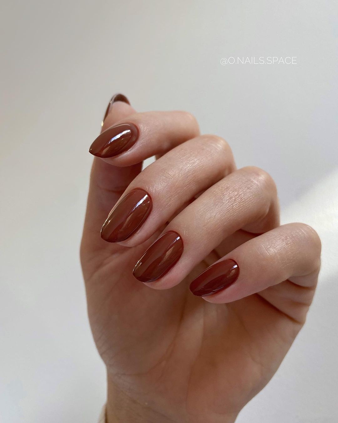 Almond-Shaped Nails with a Glossy Chocolate Brown Finish