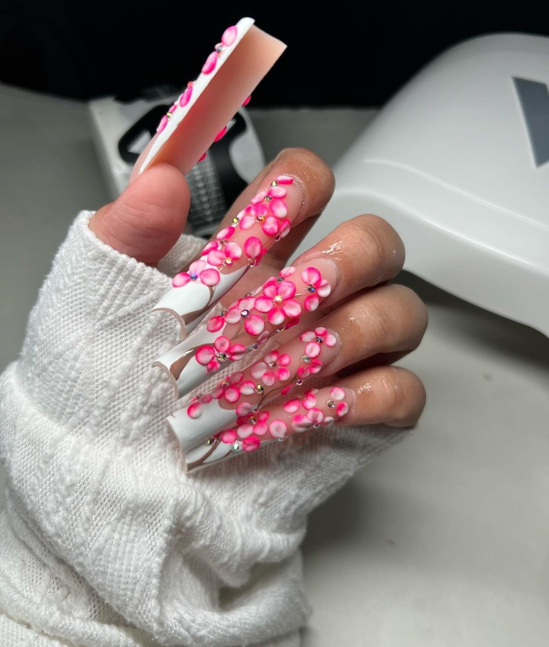 White Nails with 3D Pink Floral Art and Crystal Details