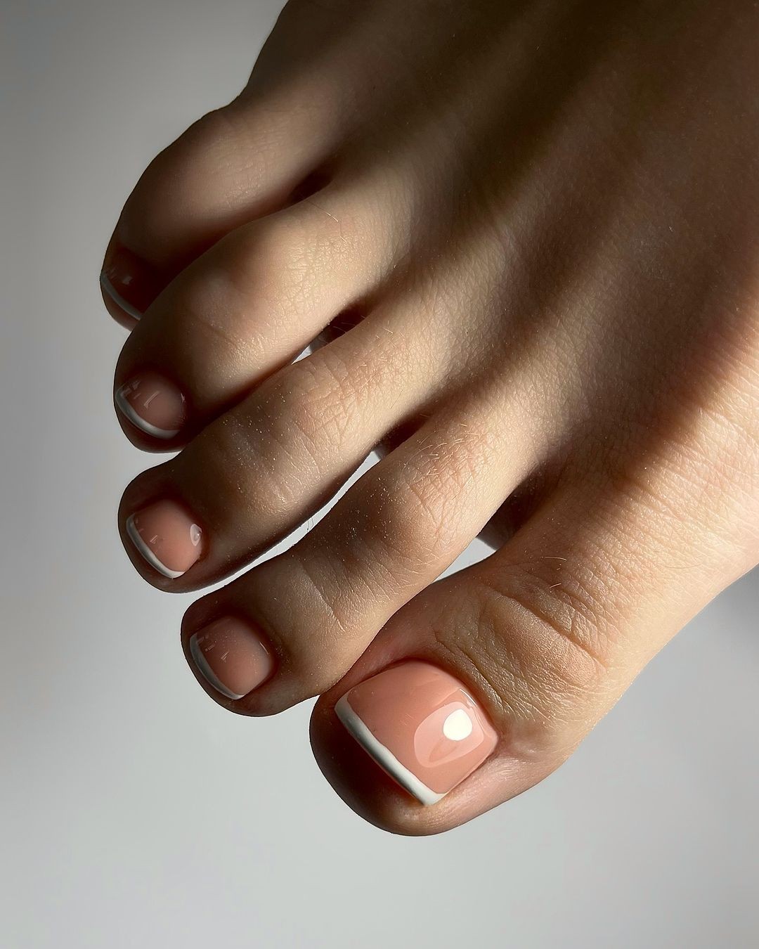 Classic French Tips with a Modern Twist: Short and Sweet