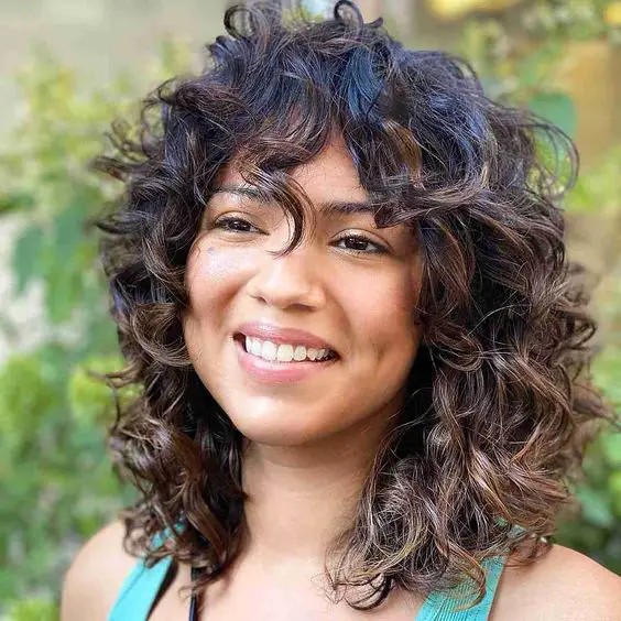 Curly Haircut with Curly Bangs: