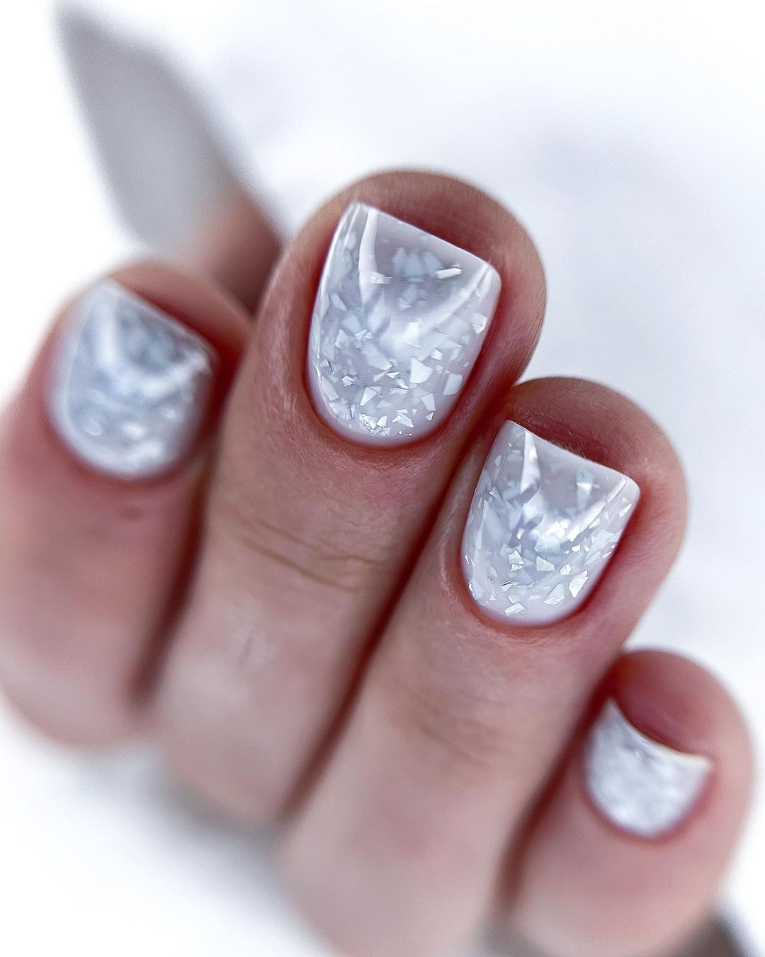 White Nails with Silver Glitter Encapsulated Tips