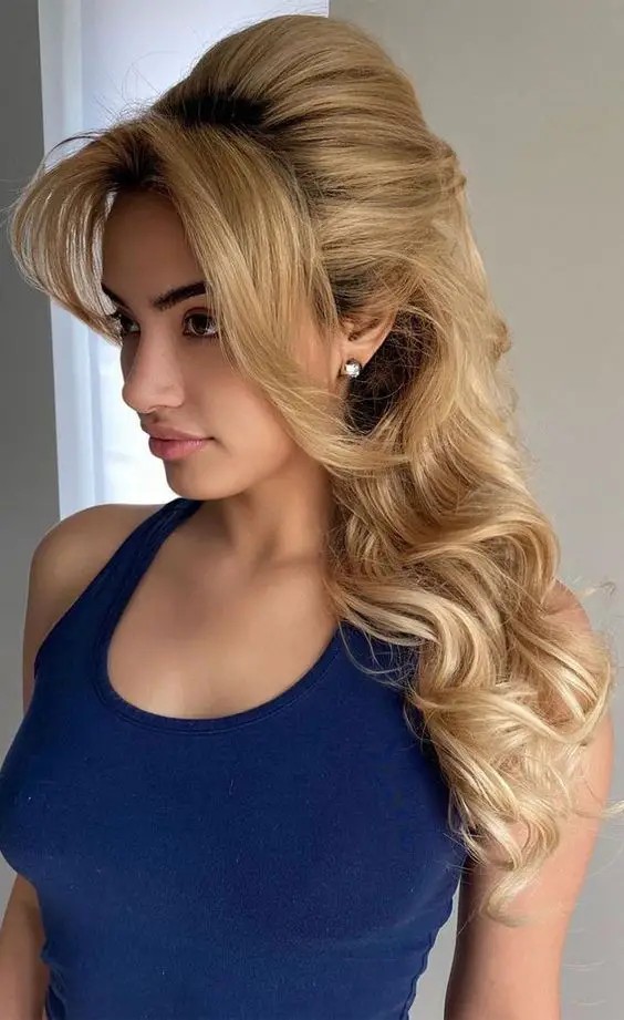 Voluminous Ponytail with Curtain Bangs