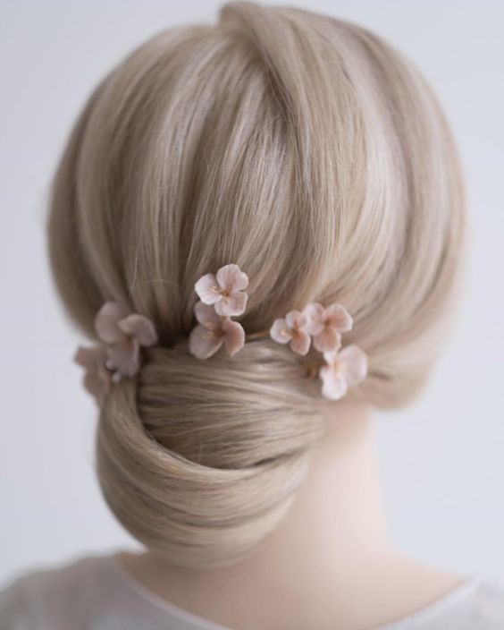 Chic Low Bun with Floral Accessories