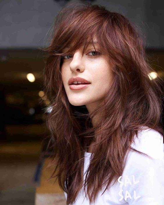 Layered Haircut with Side-Swept Bangs