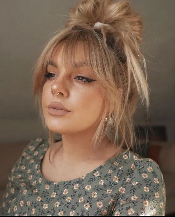 Messy Bun with Curtain Bangs