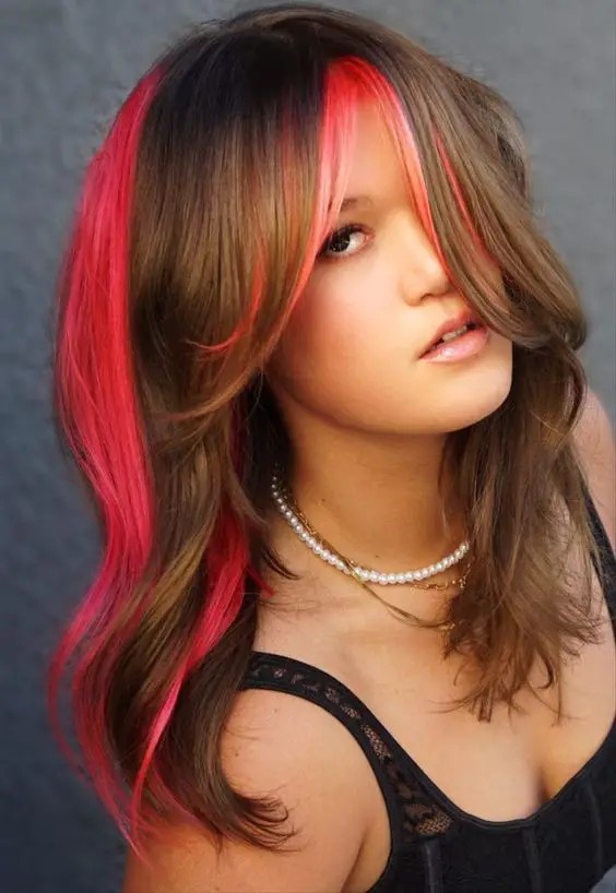 Edgy Red Streaks on Brunette Locks