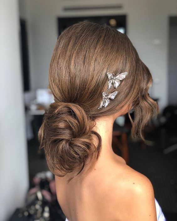 Idea 17: Elegant Updo with Butterfly Accents