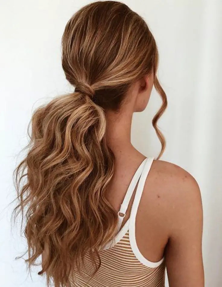 Voluminous Ponytail with Wrapped Hair