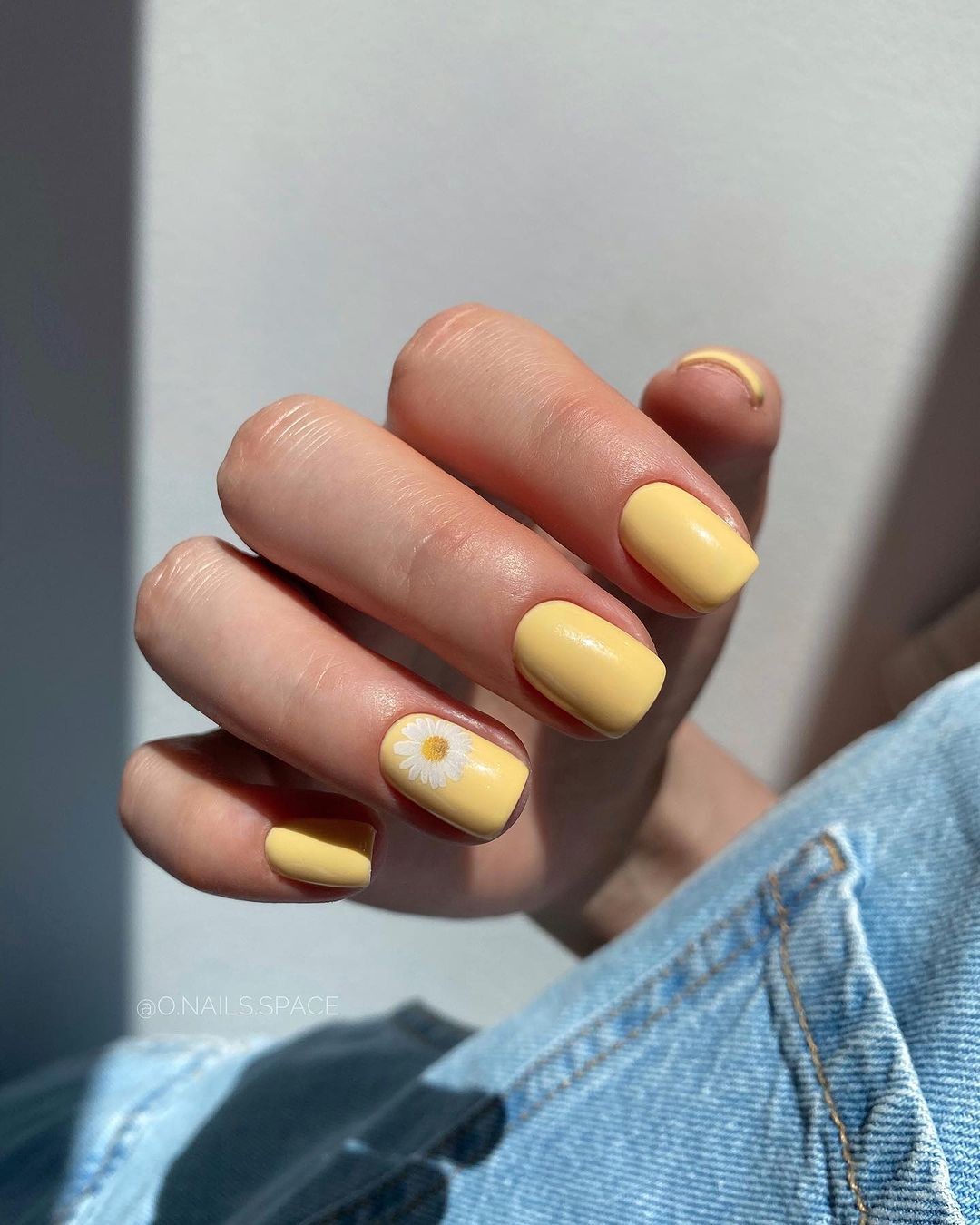 Mustard Yellow Nails with a Single Daisy Design