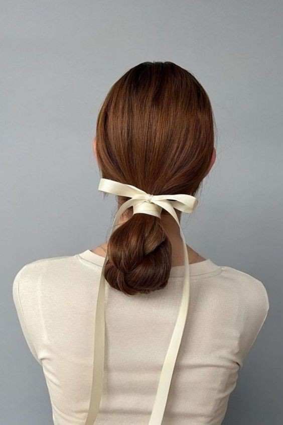 Low Bun with a Cream Ribbon