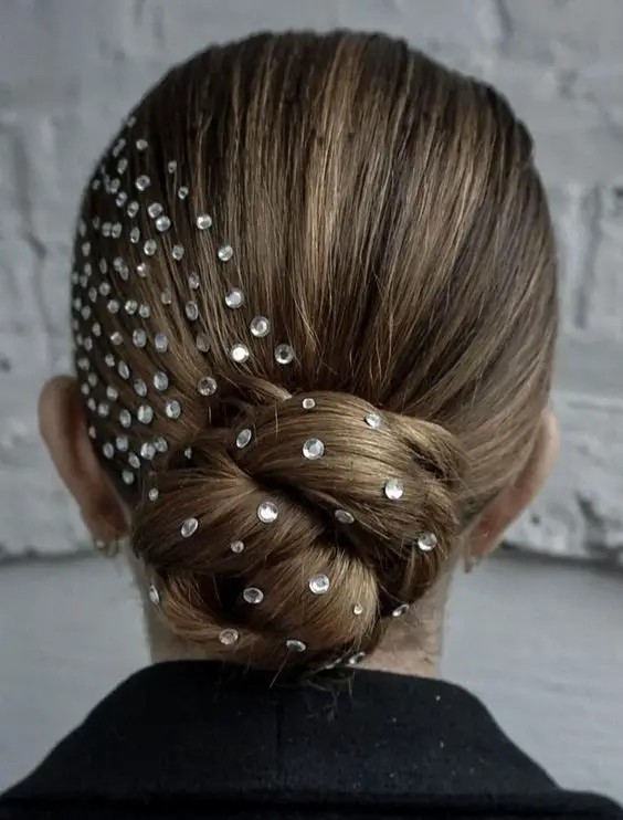 Sleek Chignon with Delicate Sparkles