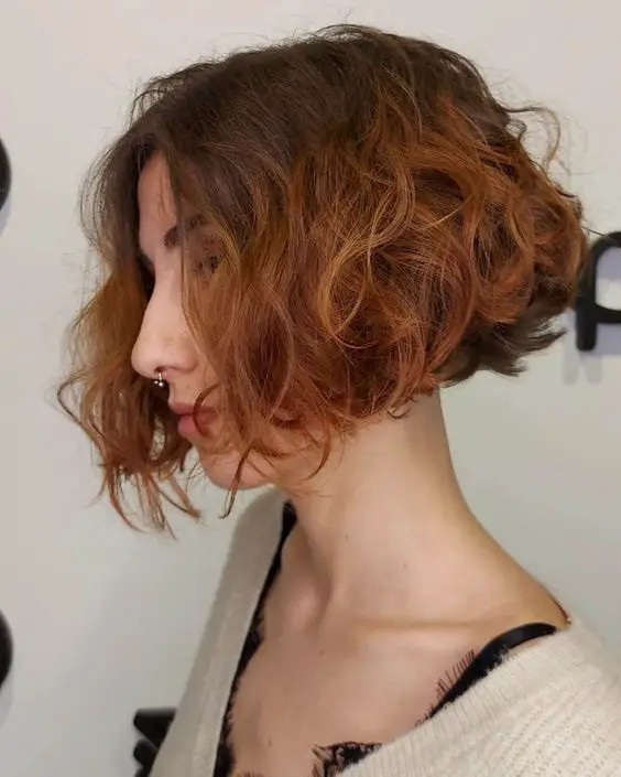 Curly Bob with Side-Swept Bangs: