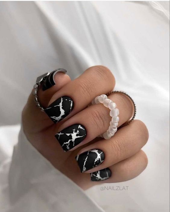 Abstract Artistry: Black Marbled Nails