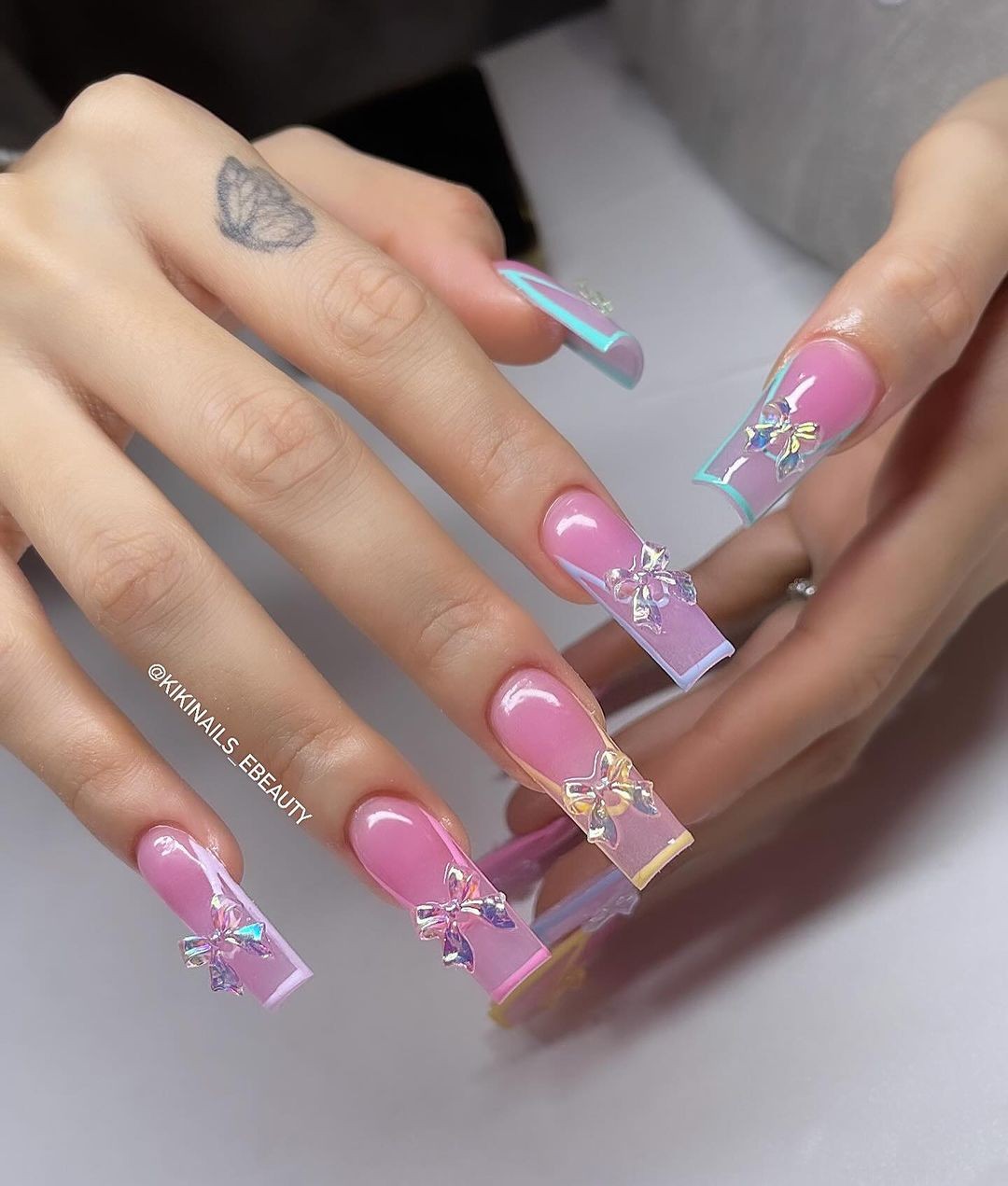 Pink Nails with Iridescent Foil and Bow Accents