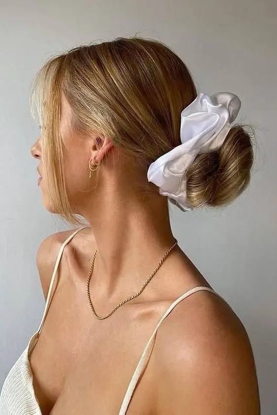 Low Bun with Curtain Bangs