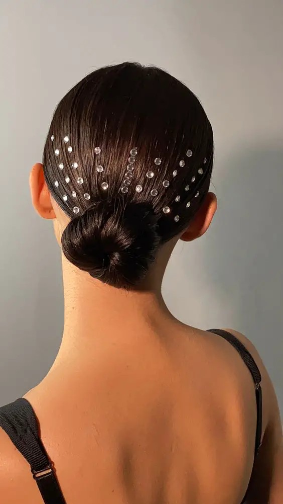 Sleek Chignon with Delicate Sparkles