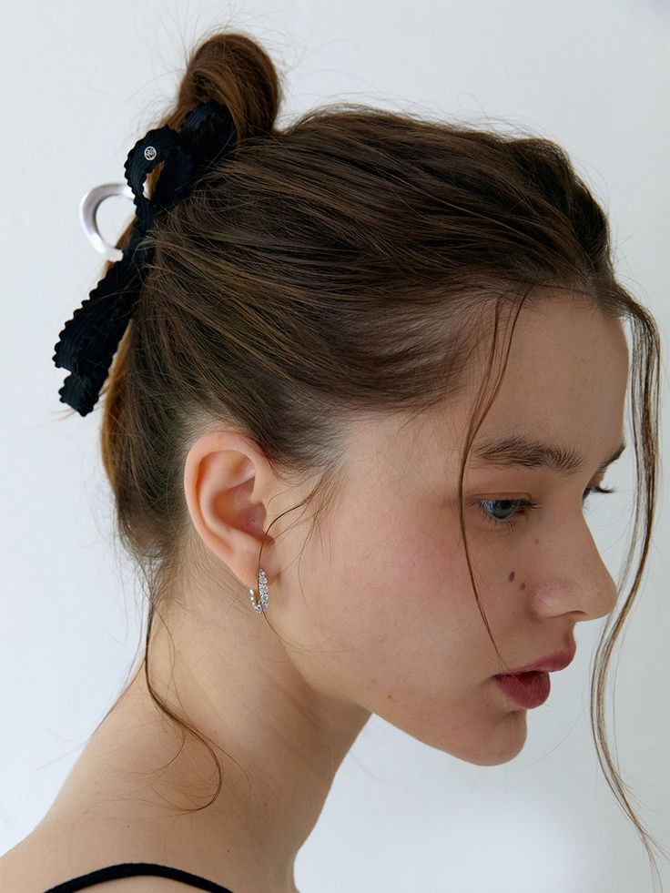 Modern Twist: A Topknot with a Bold Accessory