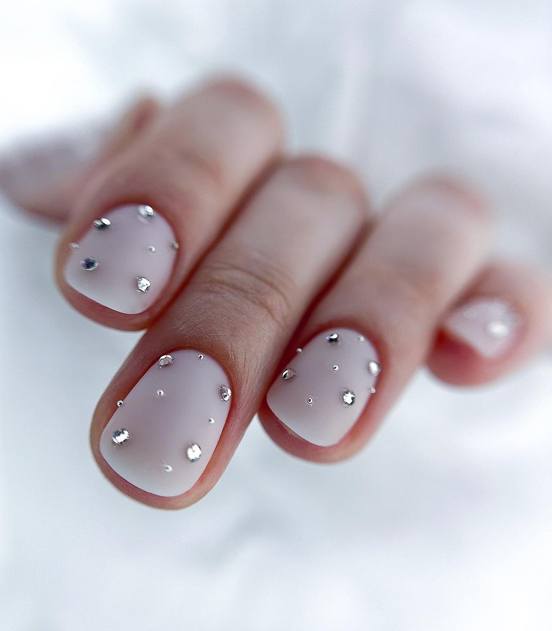 Sheer Nails with Scattered Rhinestone Accents