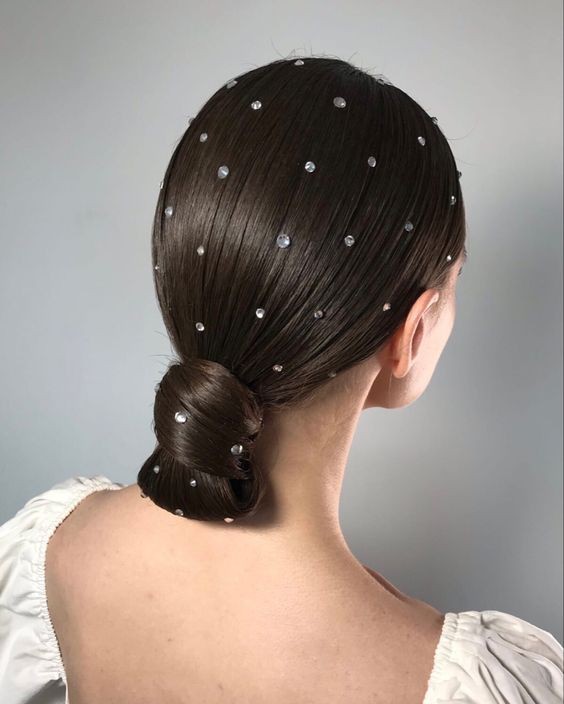 Sleek Chignon with Delicate Sparkles