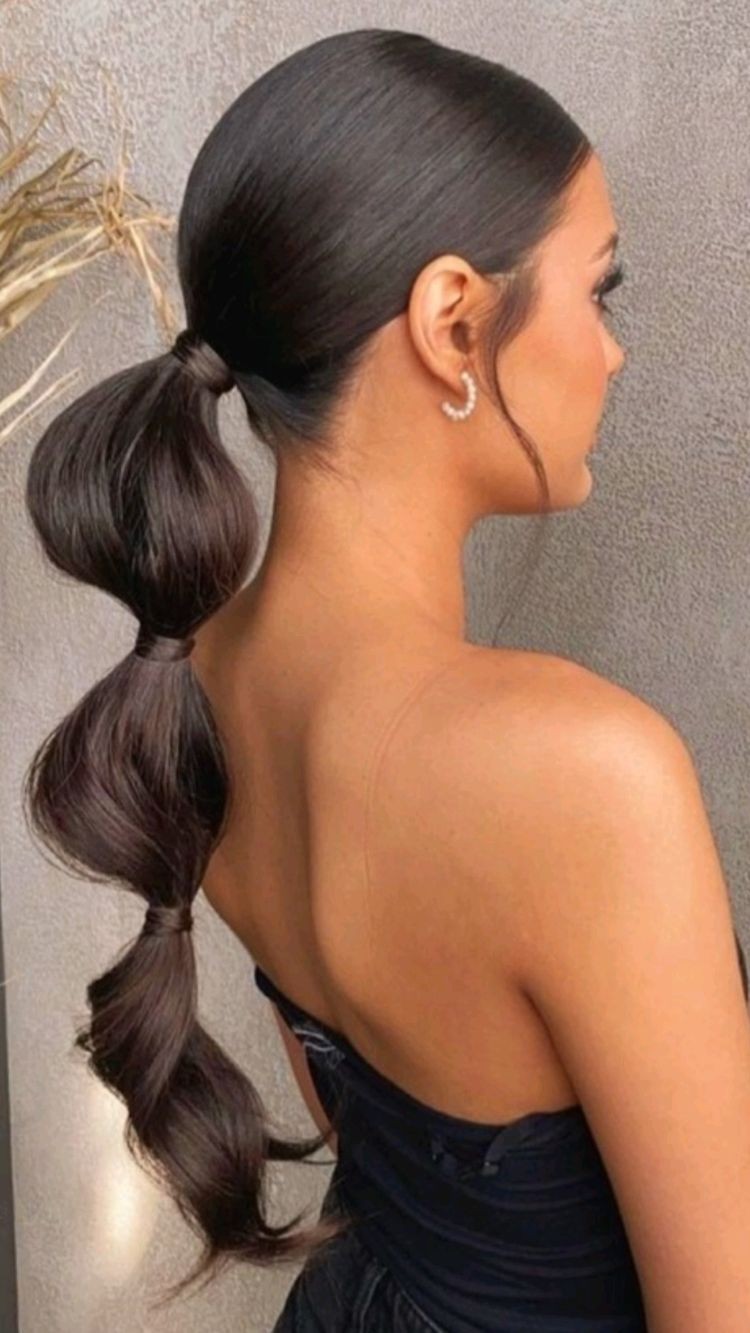 Sleek Low Ponytail Waves