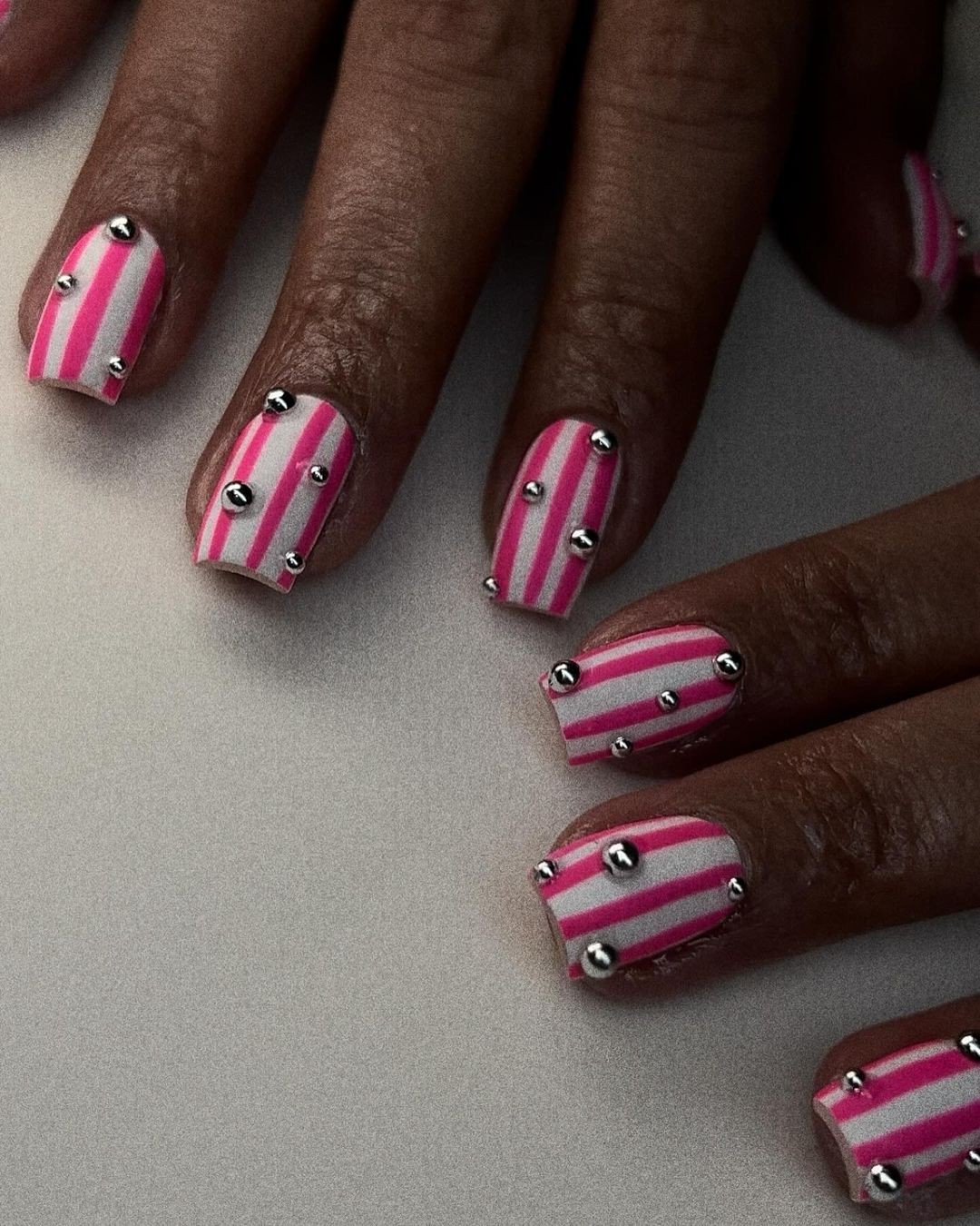 Pink Stripes and Silver Studs: Bold and Edgy