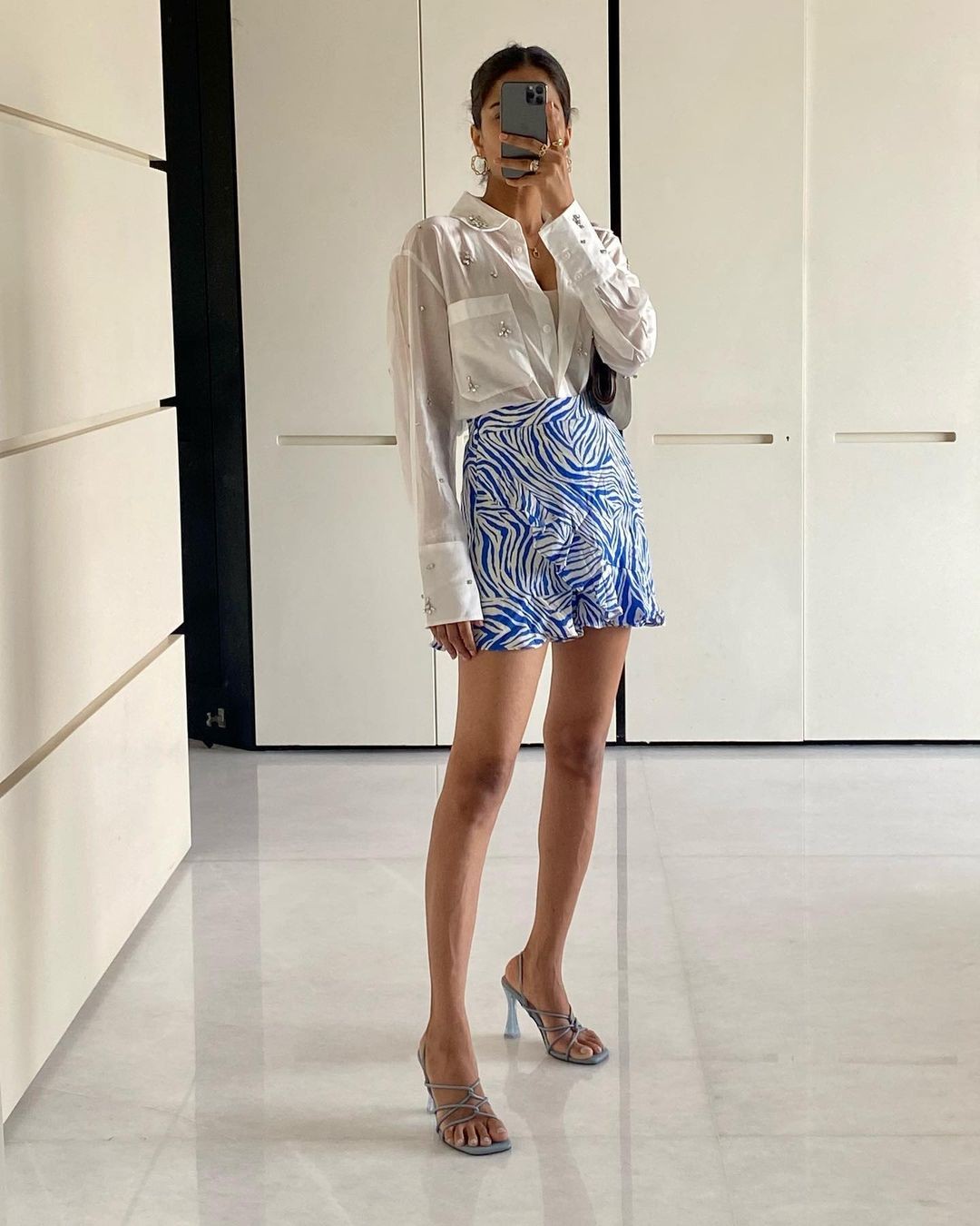 White Shirt and Patterned Blue Skirt