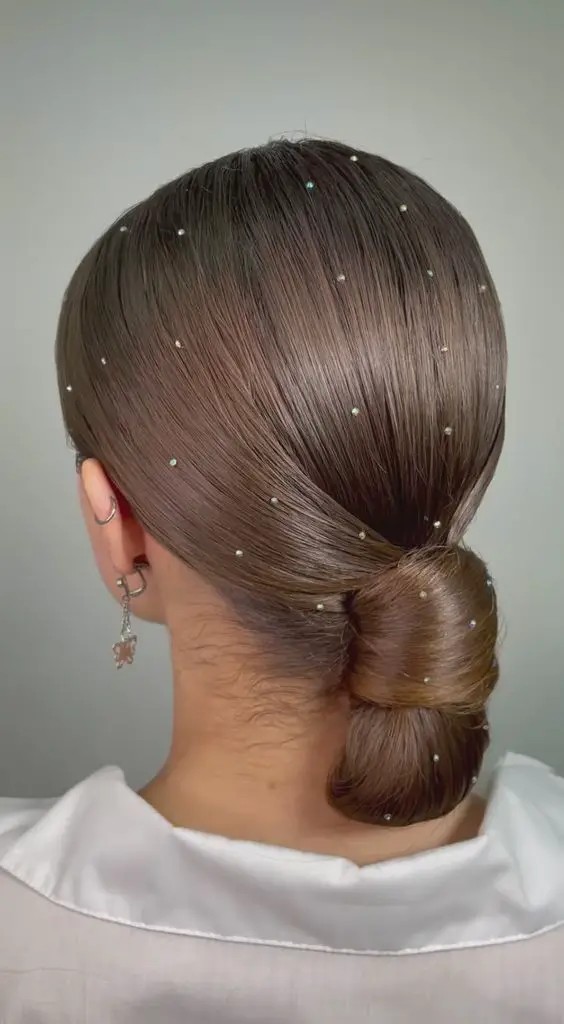 Sleek Chignon with Delicate Sparkles