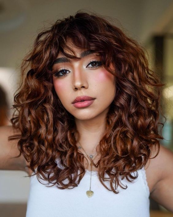 Idea 19: Long Curly Hair with Bangs