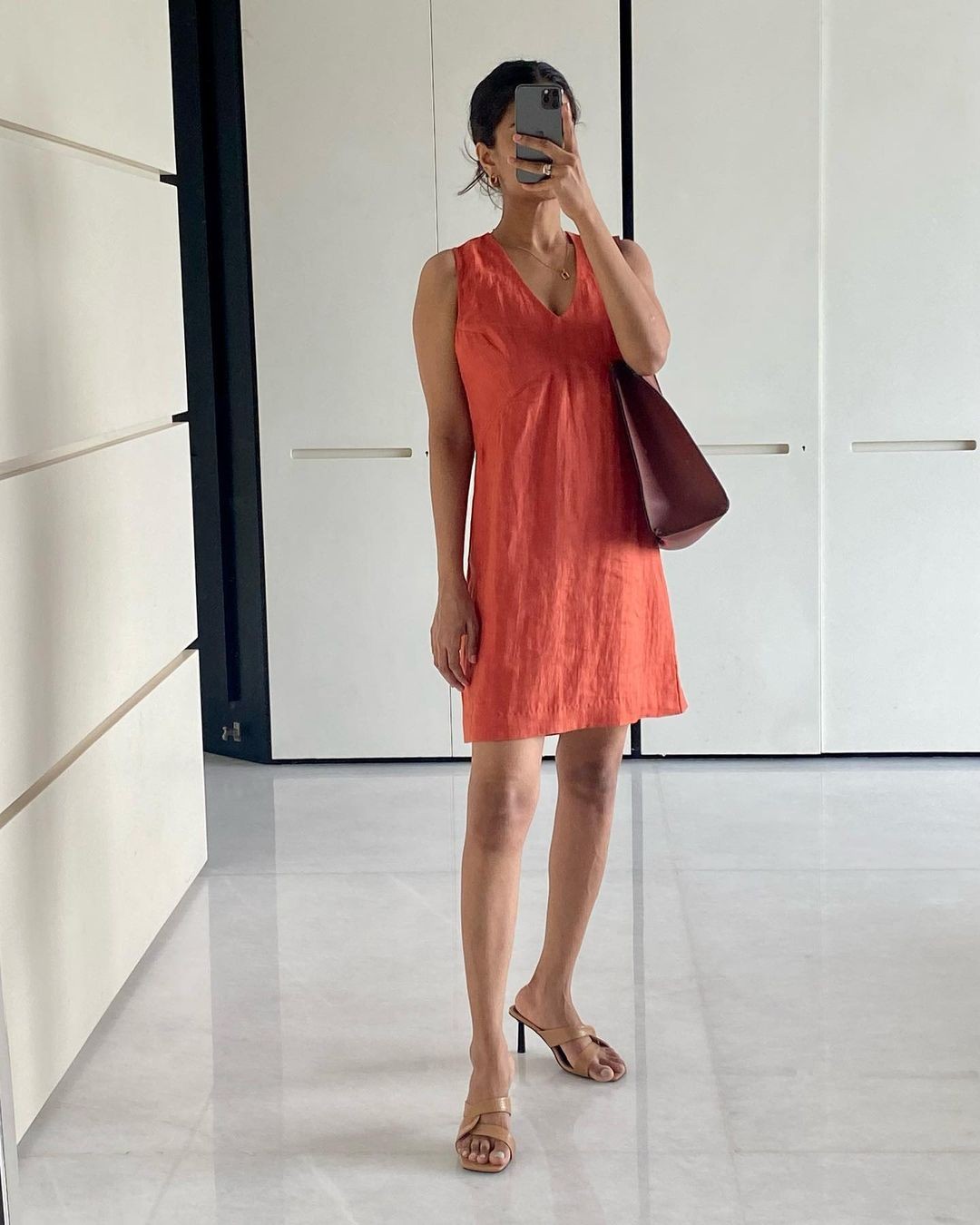 Simple Coral Dress with Brown Bag