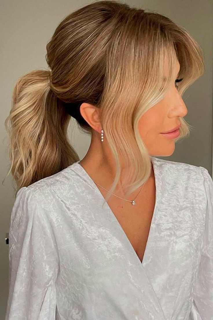 Layered Bangs with Low Ponytail: