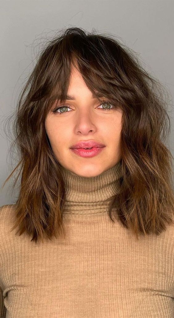 Round Face with Shoulder-Length Hair and Bangs: Flattering Silhouette