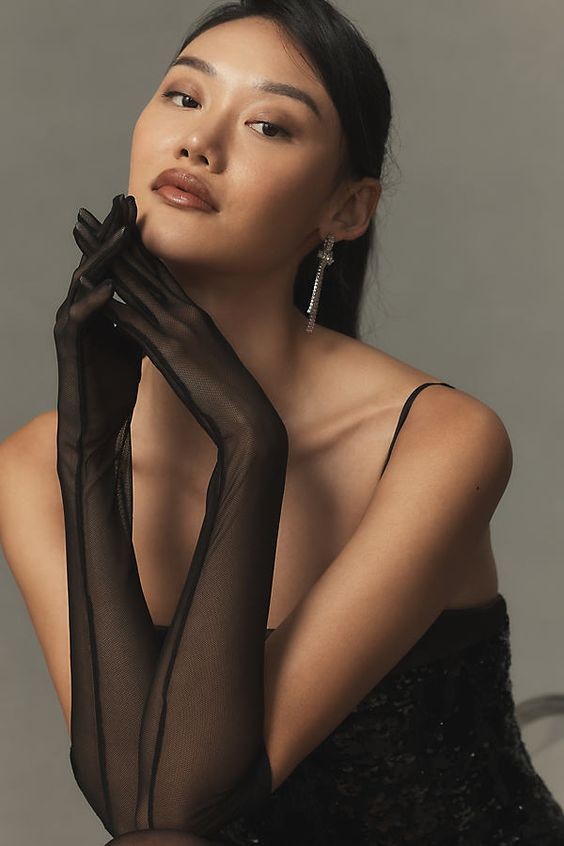 Sleek Elegance: The Sheer Black Glove Statement