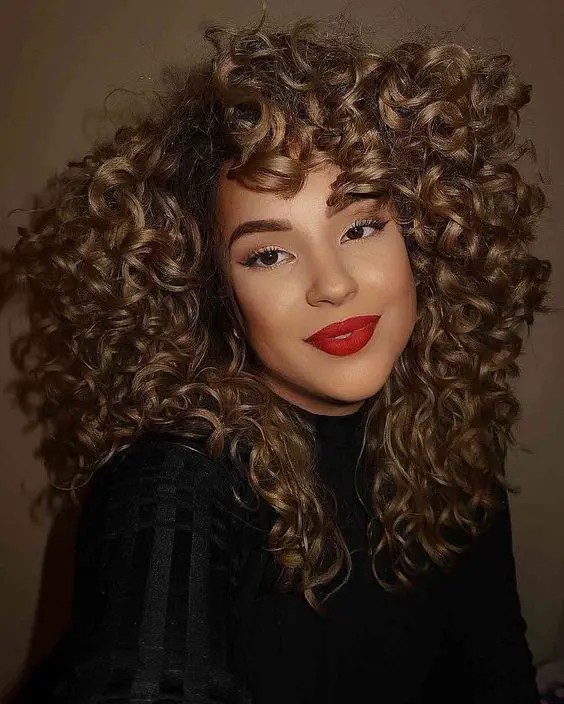 Curly Bangs with Voluminous Curls: