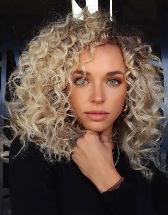 The Blonde Ambition: Bold Curly Blonde