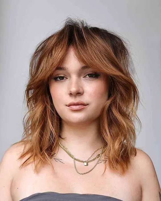 Layered Shoulder-Length Hair with Curtain Bangs