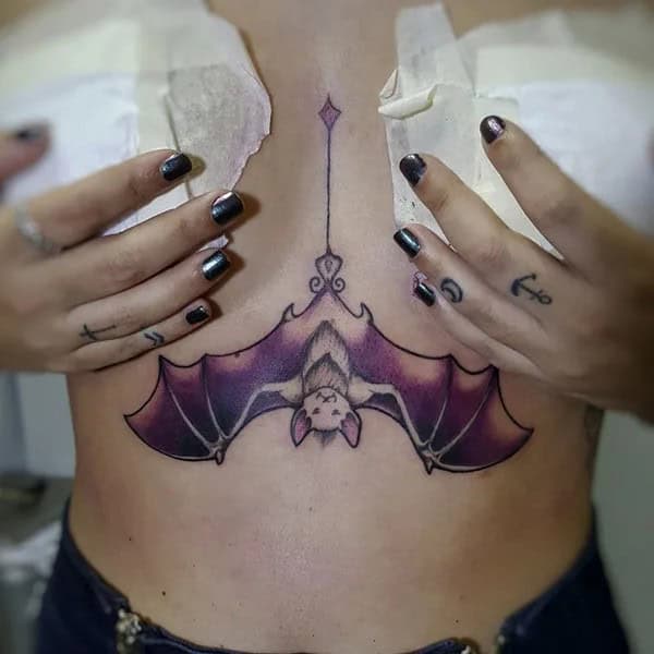 Bat Under Breast Tattoo