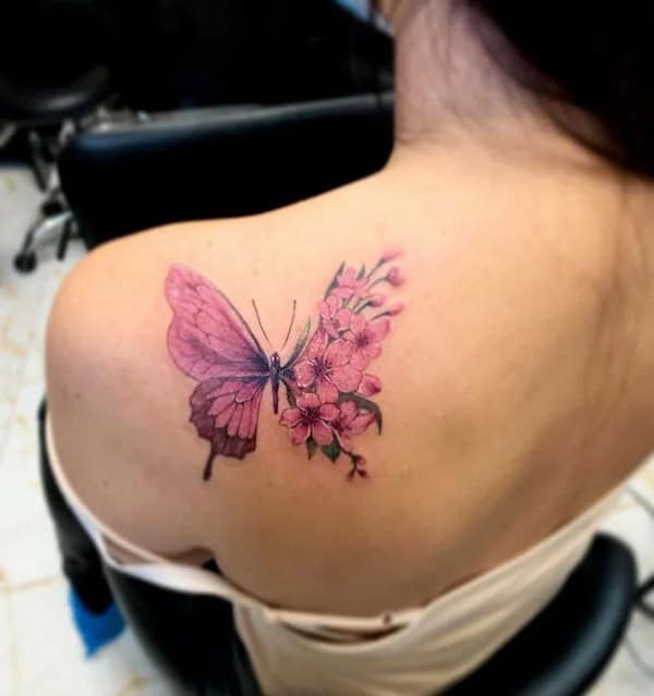 Half butterfly half flower forearm tattoo