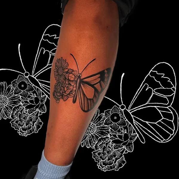 Half butterfly half flower forearm tattoo