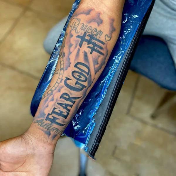 Fear God Tattoo on Forearm