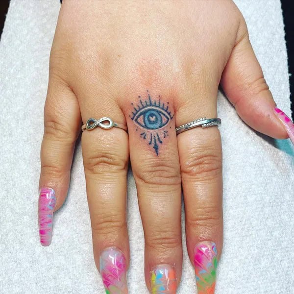 Evil Eye Finger Tattoo