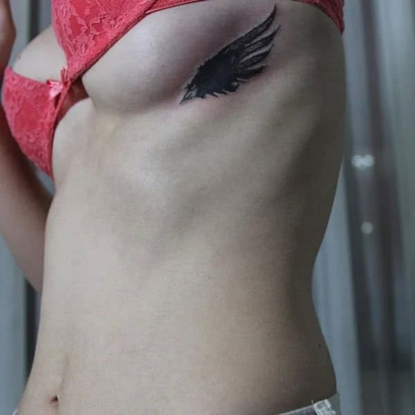 Wings Under Breast Tattoo