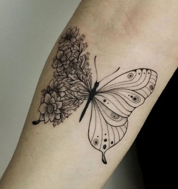 Half butterfly half flower forearm tattoo