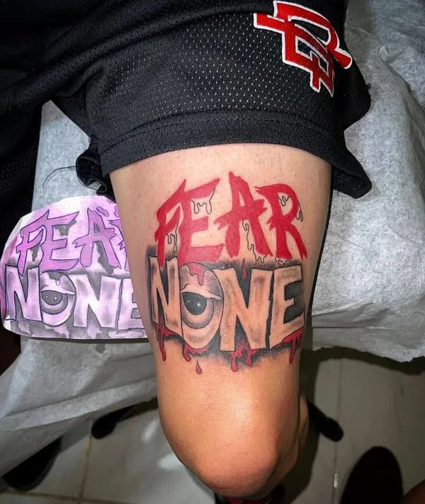 Above the Knee “Fear None” Tattoo