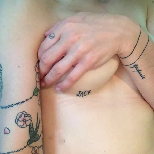 Name Under Breast Tattoo