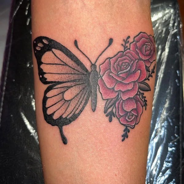 Half butterfly half flower forearm tattoo