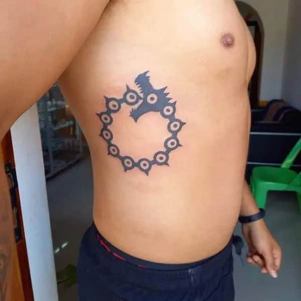 Rib Ouroboros Tattoo